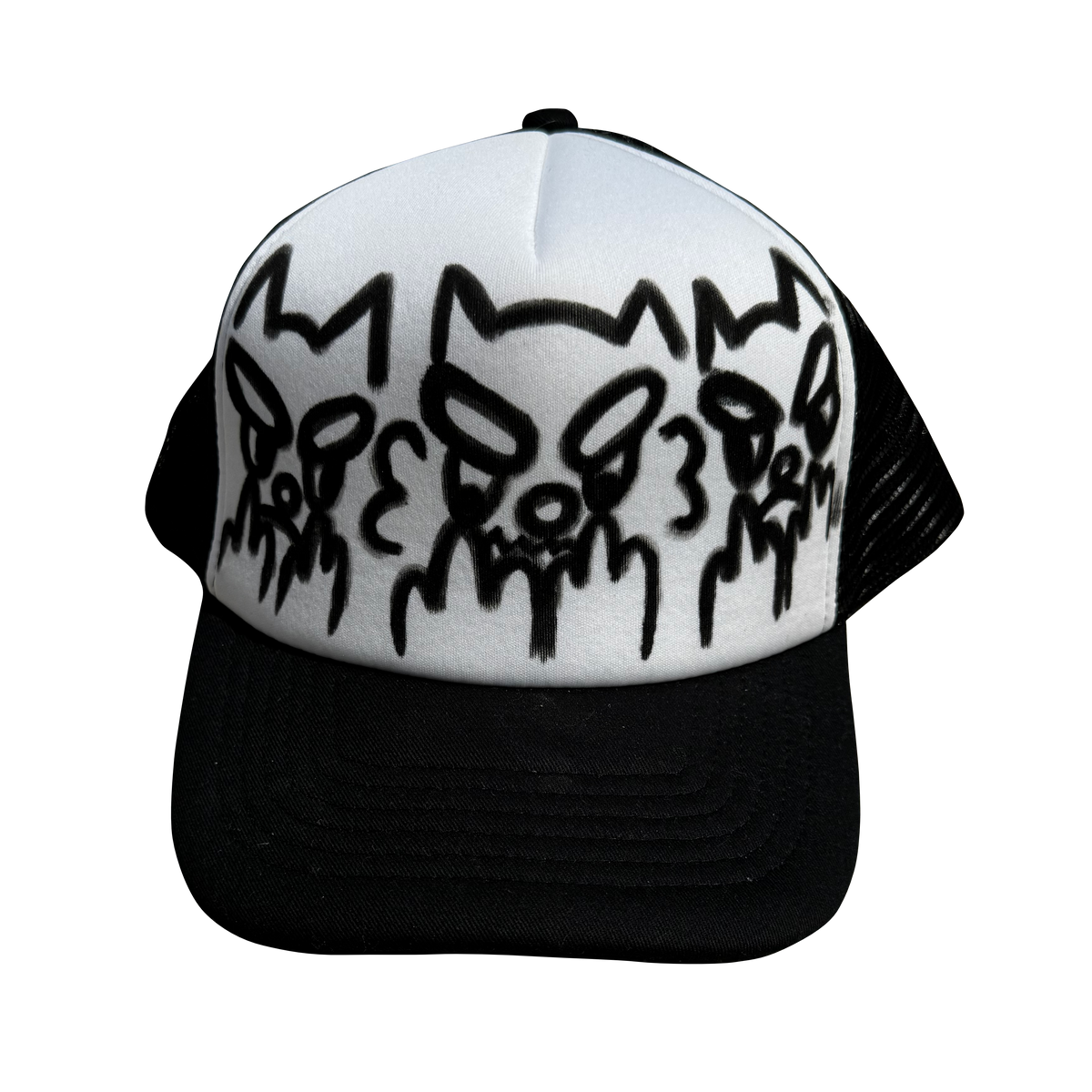 A black and white trucker hat featuring three stylized black skull graphics on the white front panel, with a black mesh back and black brim.